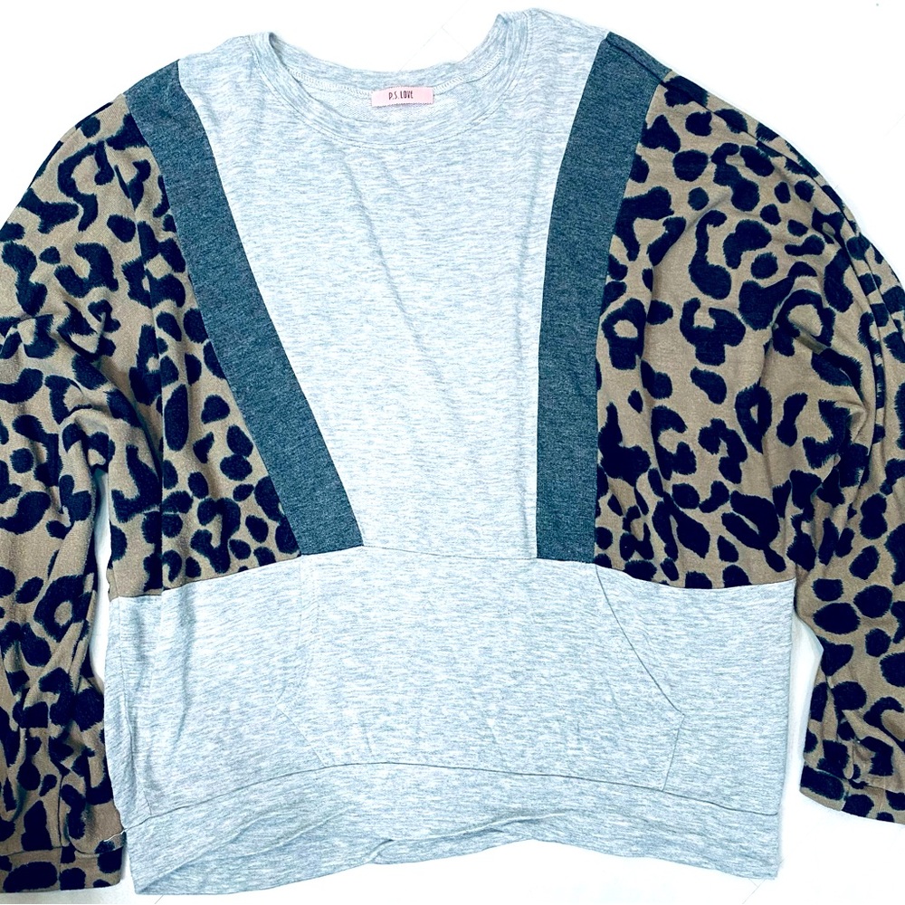 Leopard and grey long sleeve shirt with one open pocket in the front. Large